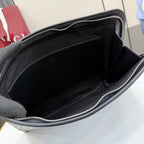 Gucci small bag interior, black lining with open compartment and zipper top.
