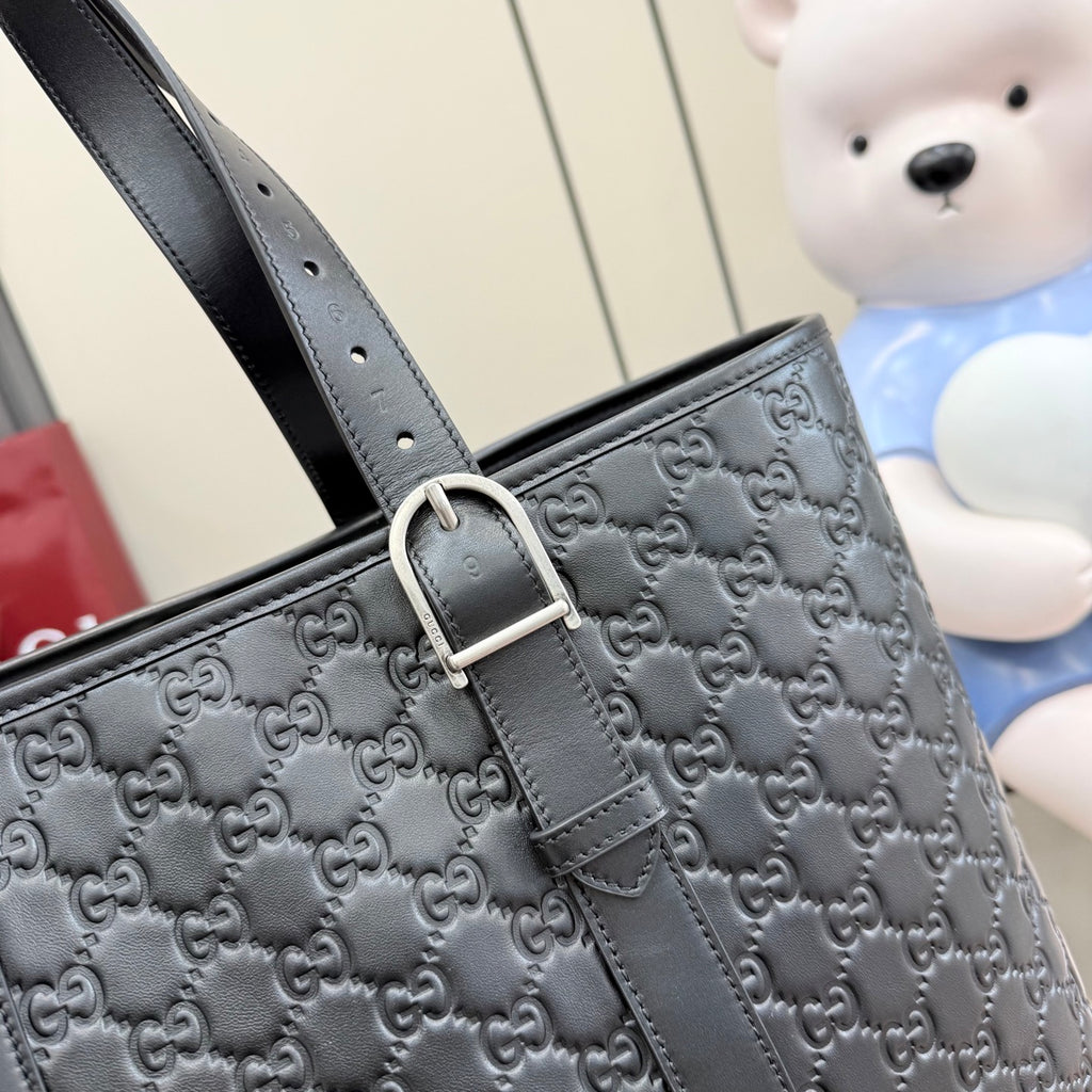 Gucci small tote bag in dark gray GG monogram with metal buckle and strap detailing