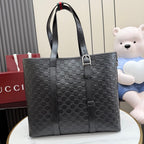 Gucci small tote bag in dark gray with GG monogram, front view with top handle