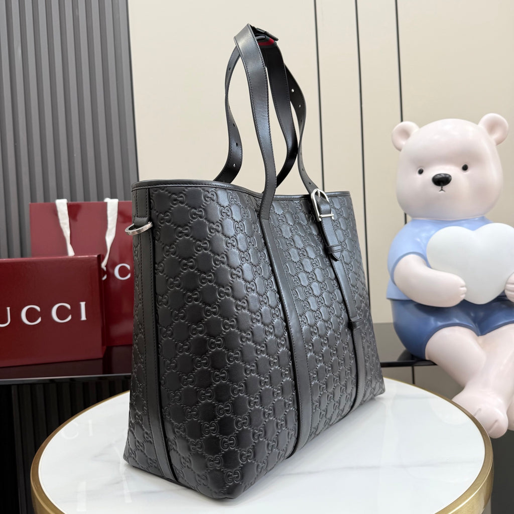 Gucci small tote bag in dark gray with GG monogram, side profile and shoulder strap