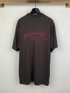 Dark crew-neck T-shirt with red Balenciaga-style logo graphic on back