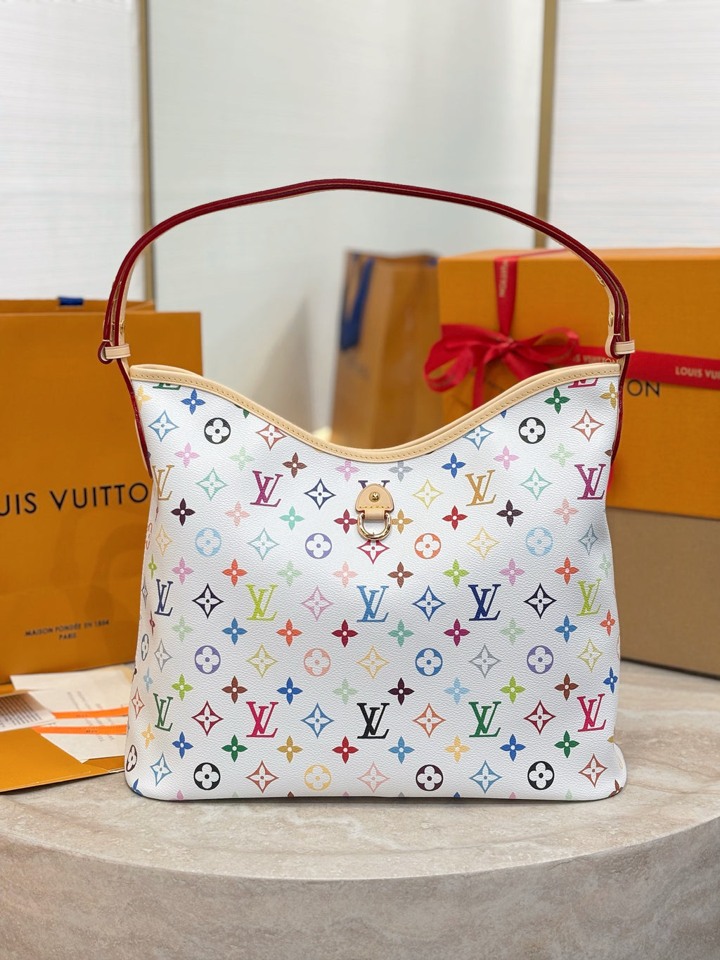 Hobo bag in multicolor monogram canvas with red handles and front zip pocket