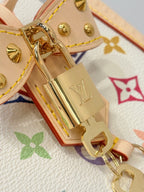 Gold-tone lock and charms on multicolor monogram bag lining