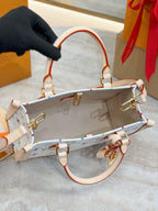Multicolor monogram bag with red-and-white strap, open top, gold clasps