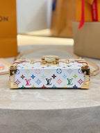 Louis Vuitton mini bag with multicolor Monogram print and top handle, beige trim, gold clasps