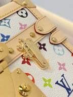 Louis Vuitton mini bag hardware close-up with gold clasps on multicolor Monogram canvas