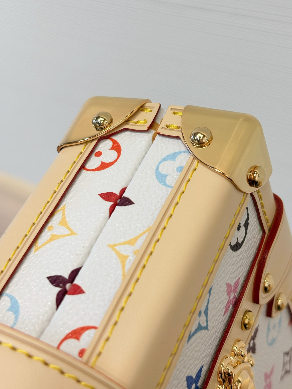 Louis Vuitton mini bag top opening with multicolor Monogram lining and beige leather hardware