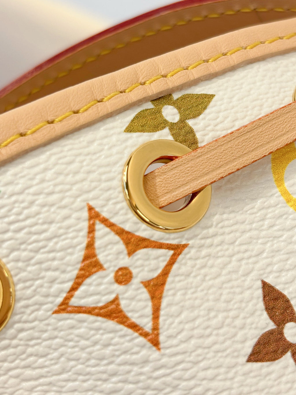 Louis Vuitton bag strap loop with gold hardware and multicolor monogram pattern