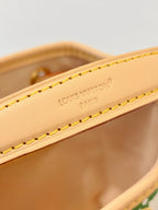 Louis Vuitton strap close-up with “Louis Vuitton Paris” embossing and yellow stitching