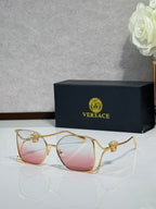 Versace sunglasses with gold frame and rose-pink tinted lenses
