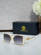 Versace sunglasses with gold metal frame and dark gray lenses
