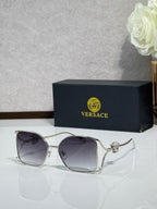 Versace sunglasses with silver frame and dark purple tinted lenses