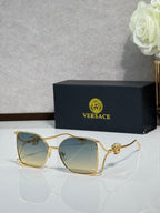Versace sunglasses with gold metal frame and tinted dark lenses