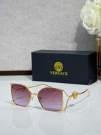 Versace sunglasses with gold frame and pink tinted lenses