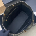 Open dark green tote bag interior with zip pocket and gold-tone hardware