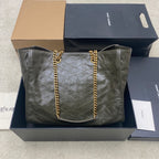 YSL tote bag in dark green pebbled leather with gold chain handles and front emblem