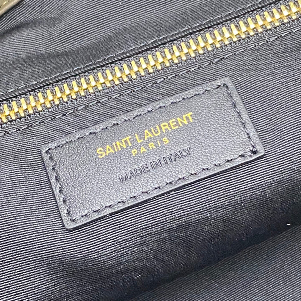 Saint Laurent Paris leather label with Made in Italy on dark green tote bag