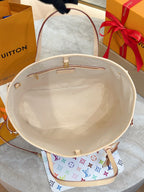 Louis Vuitton bag interior view with beige lining and multicolor monogram exterior