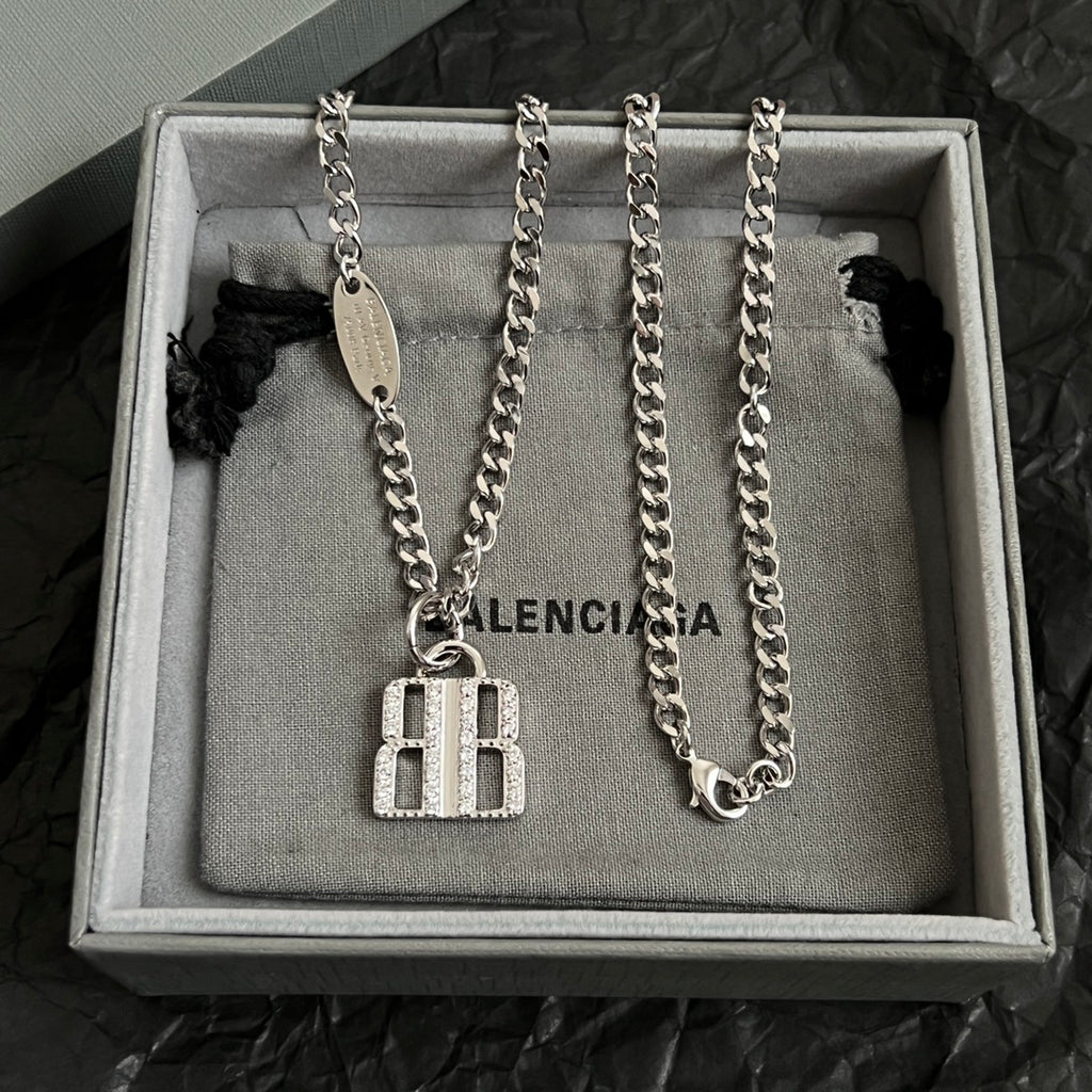 Two silver-tone chain necklaces with square charm pendants and oval tags