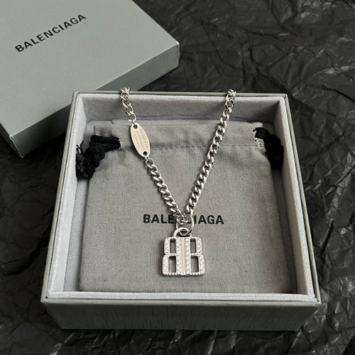 Silver-tone chain necklace with oval tag and square charm pendant