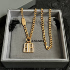 Balenciaga accessory gold chain necklace with square B logo pendant in box