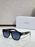 Dior sunglasses with black acetate frames, blue-tinted lenses, and gold logo detail