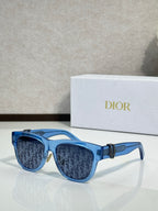 Dior sunglasses with blue frames and blue-tinted lenses, featuring a gold side logo