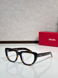 Prada sunglasses with dark tortoiseshell frames and light-gray arms, tinted lenses