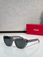 Prada sunglasses with dark gray frames and dark tinted lenses, side profile