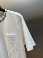 White short-sleeve T-shirt with chest pocket and small side logo