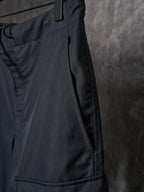 Dark drawstring pants with side seam and stitched panel