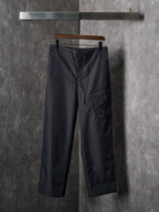 Dark drawstring pants with side pockets and front cargo pocket