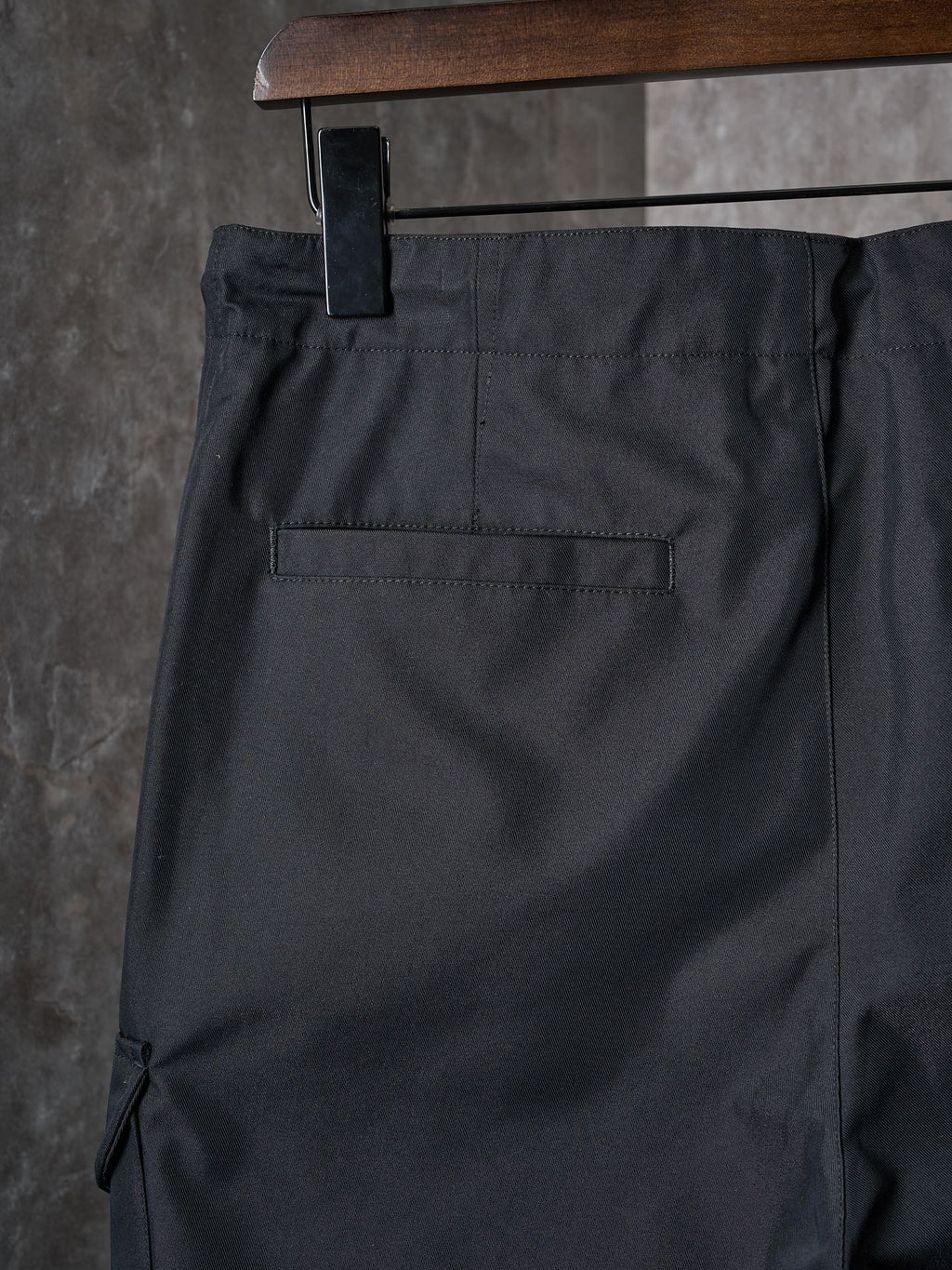 Dark pants with back welt pocket and stitched yoke panel