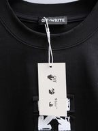 Off-White black T-shirt collar with brand tag hanging from neckline