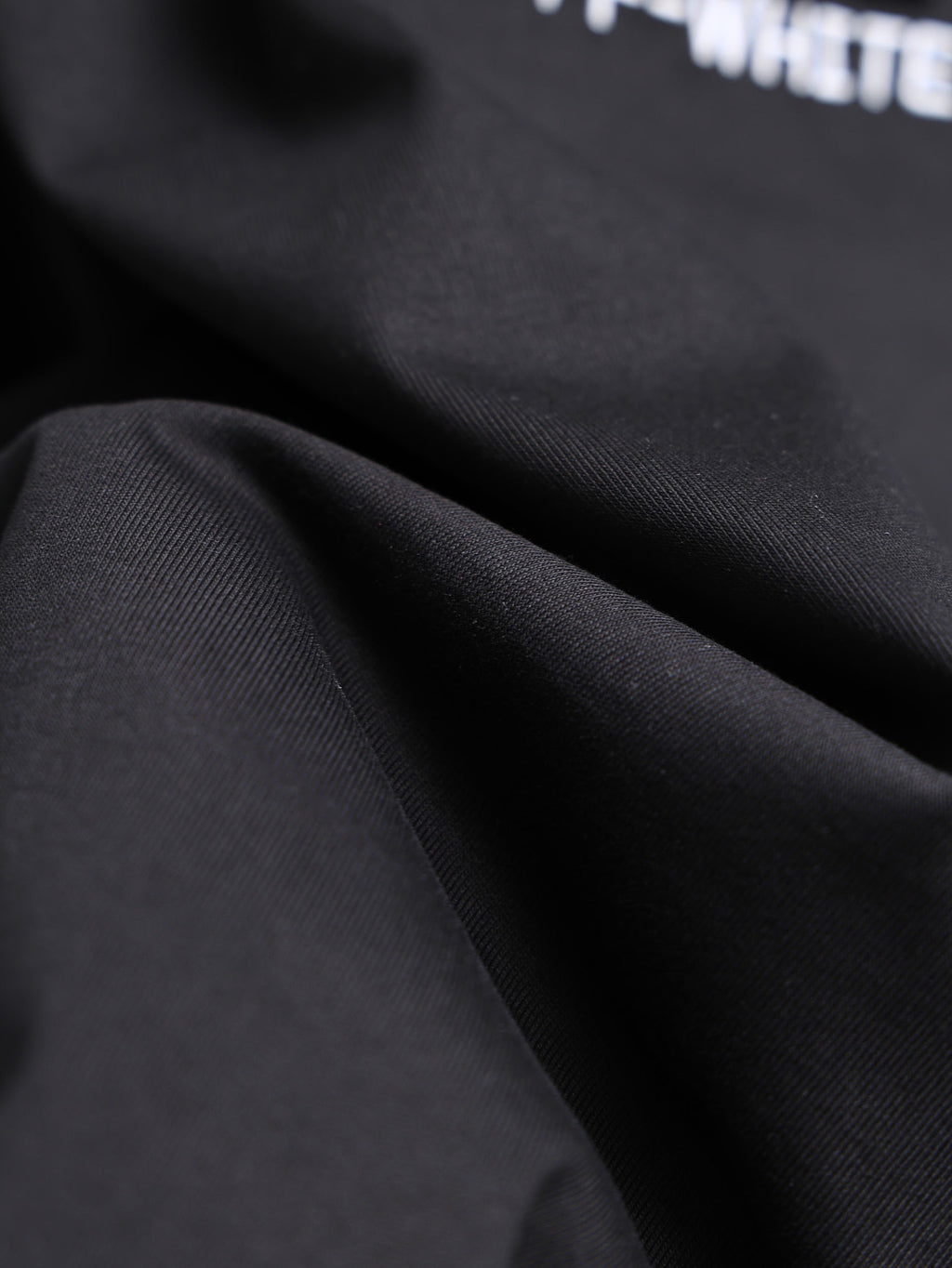 Off-White black T-shirt fabric close-up texture