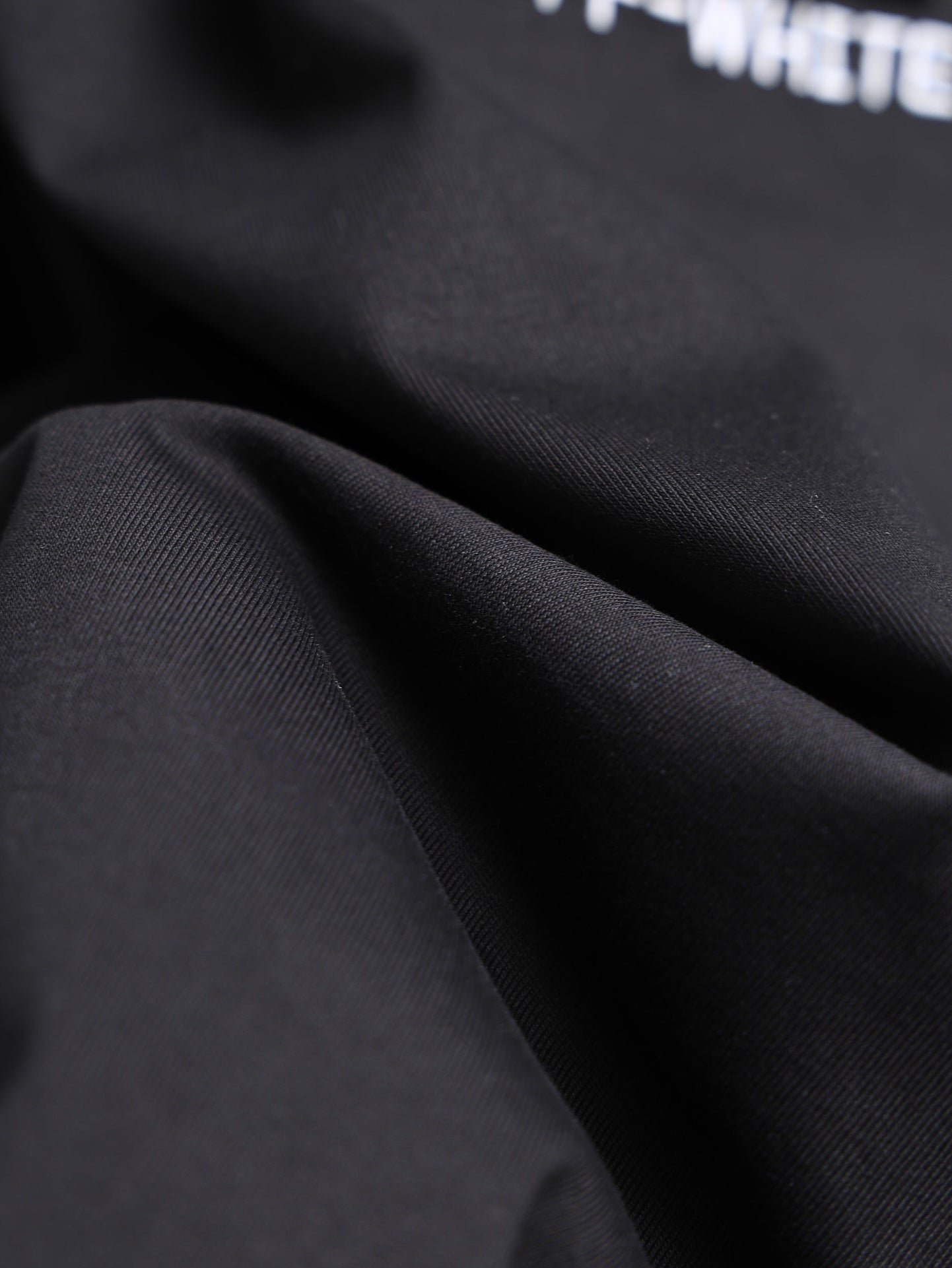 Off-White black T-shirt fabric close-up texture