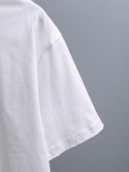 Off-White™ off white crewneck T-shirt sleeve and side seam detail.