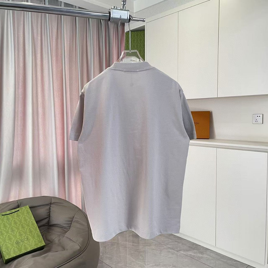 Prada short-sleeve T-shirt back view in light gray on a hanger