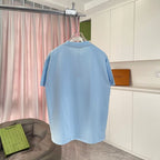 Light blue short-sleeve T-shirt back view on hanger