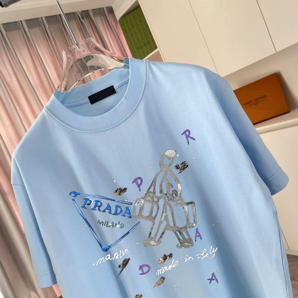 Light blue T-shirt with multicolor graphic and PRADA lettering, crew neck