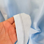 Light blue T-shirt sleeve cuff seam detail