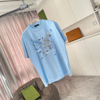 Light blue Prada short-sleeve T-shirt on hanger, front graphic print, crew neck