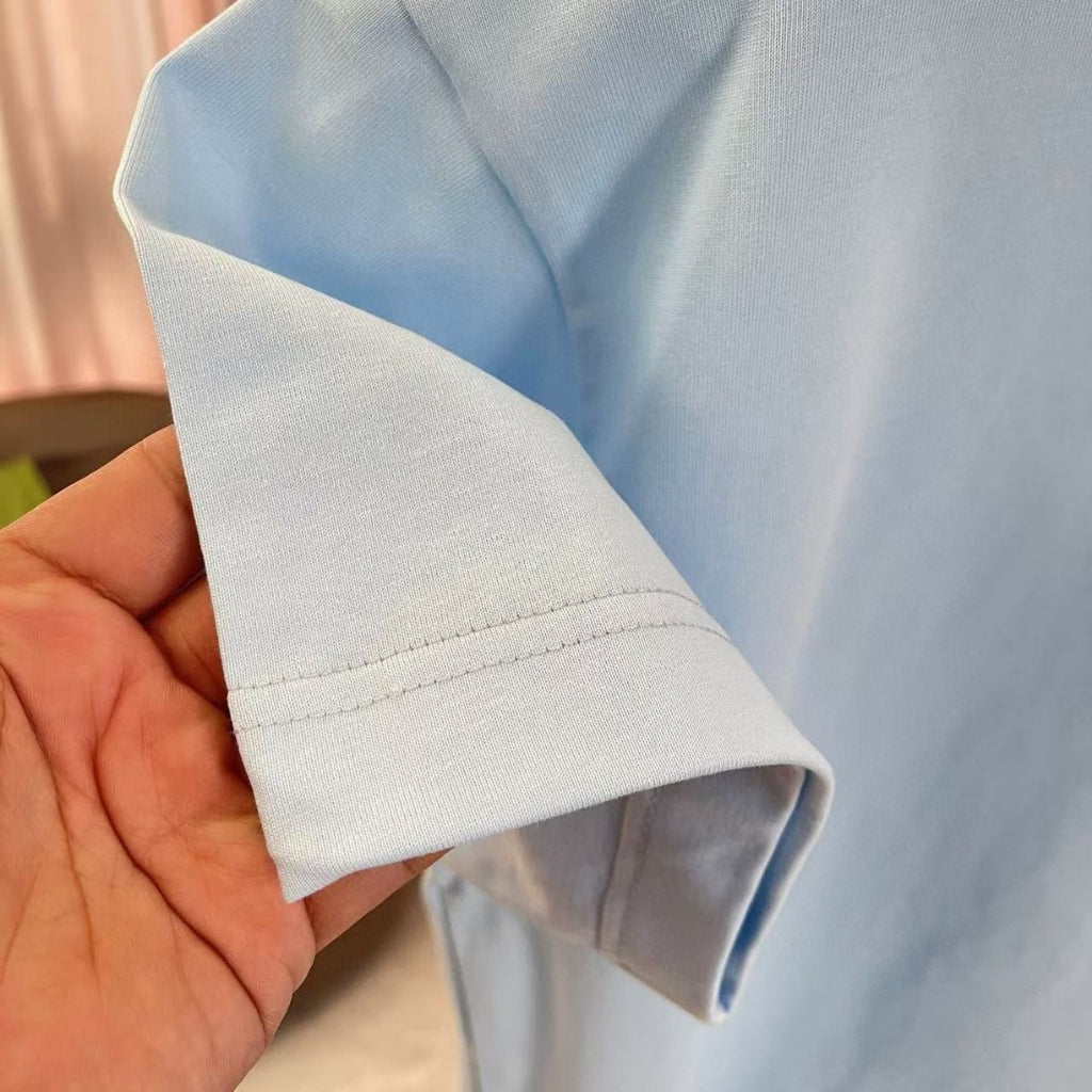 Light blue short-sleeve T-shirt cuff and folded sleeve hem close-up