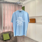 Light blue T-shirt with crew neck and white graphic print on front