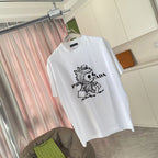 White T-shirt front with cartoon graphic and PRADA-style logo print