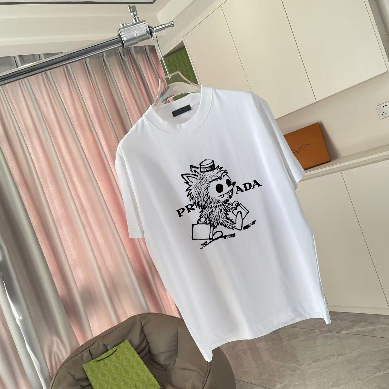 White T-shirt front with cartoon graphic and PRADA-style logo print