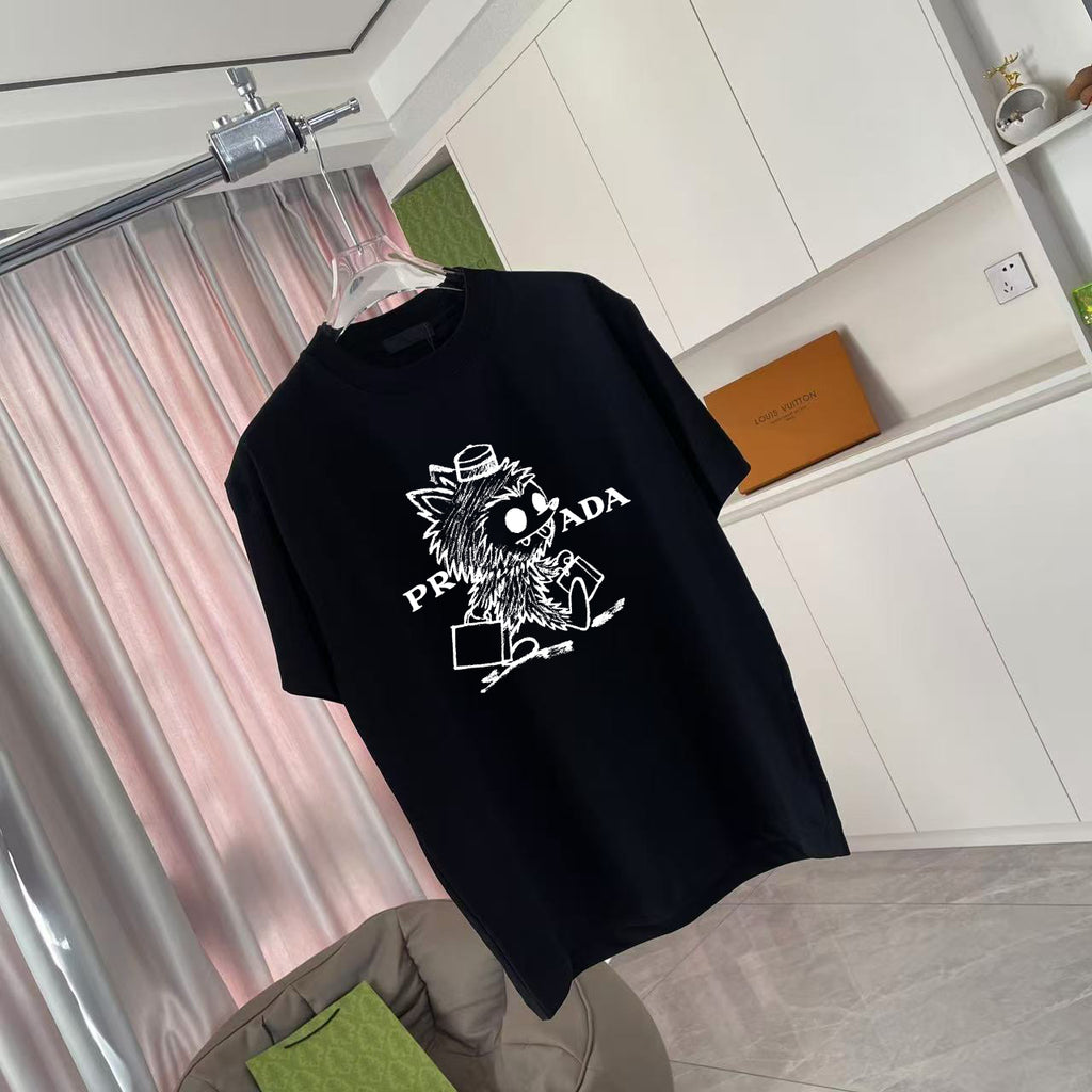 Black graphic T-shirt with Prada logo and animal print on front, angled view