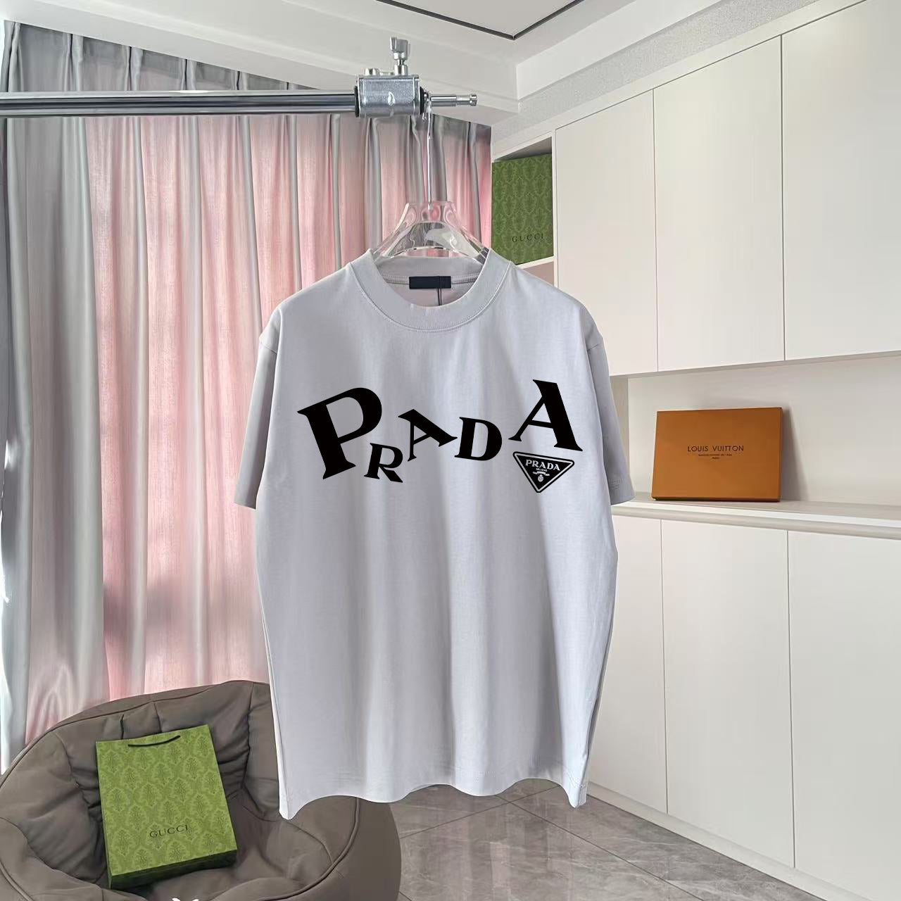 Light gray short-sleeve T-shirt with large Prada logo print on front