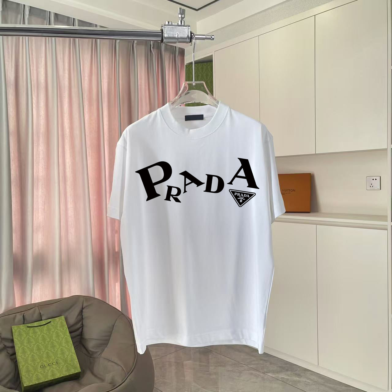 White short-sleeve T-shirt with large Prada logo print on chest