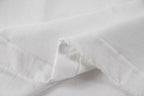 White short-sleeve T-shirt fabric with visible stitching at hem